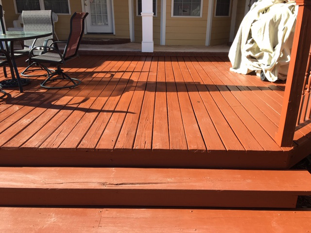 Freshly stained warm-toned outdoor deck