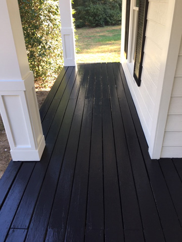 Black-stained porch flooring
