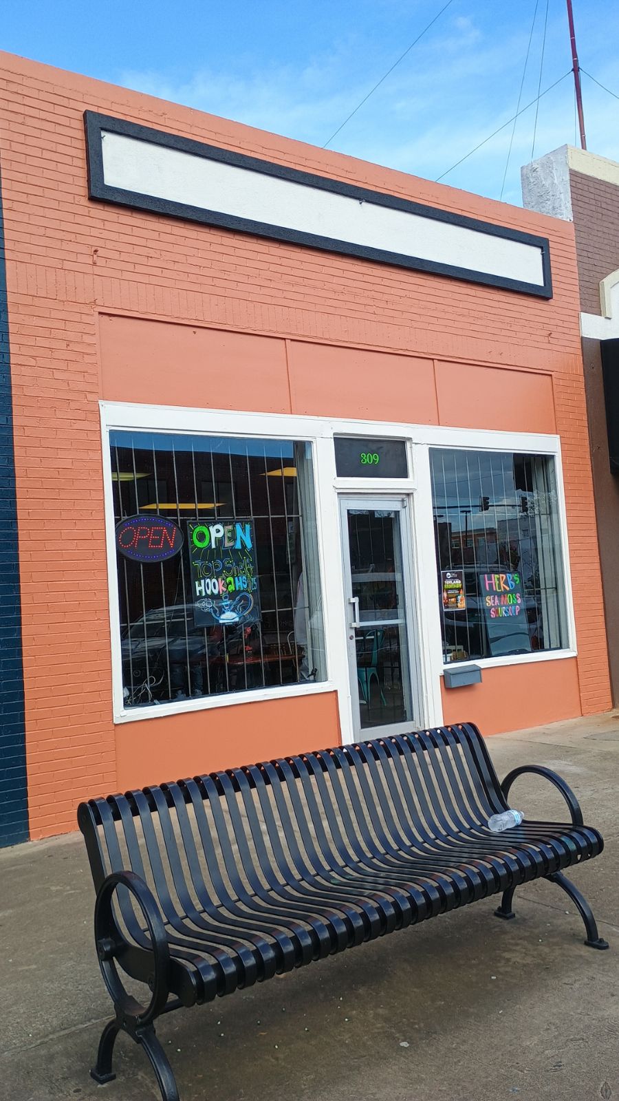 Coral and orange downtown storefront exterior
